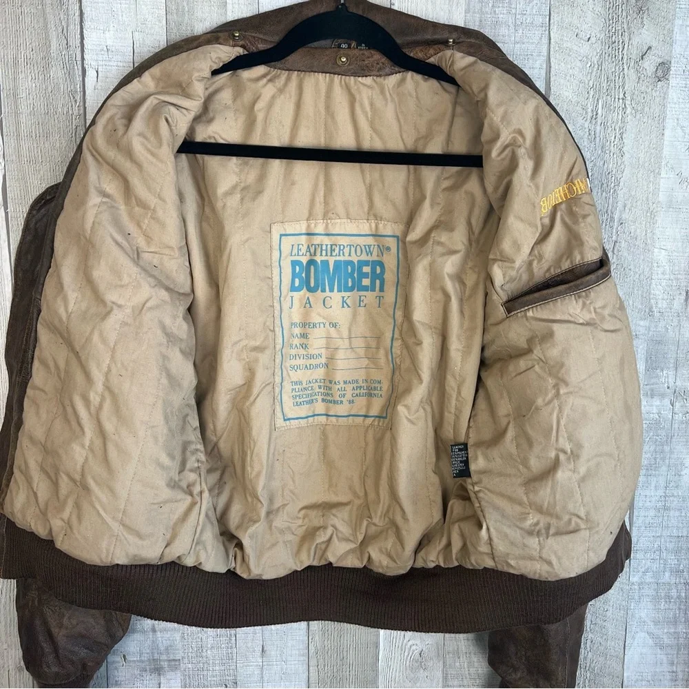 Vintage LeatherTown Bomber Aviator
Leather Jacket Size 40 Embroidered
Michelob - Picture 9 of 16